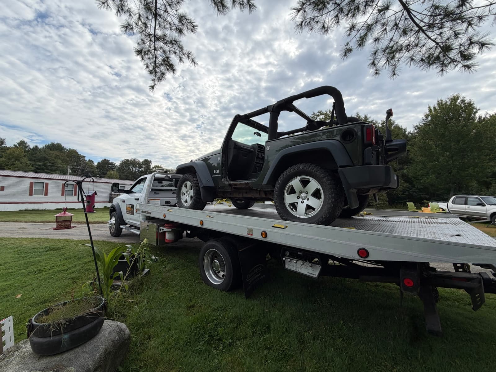 Jeep loaded on the North Point Towing flatbed